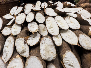 Fresh cassava in the supermarket. Vegetables and fruits exposed for consumer choice. Brazilian...
