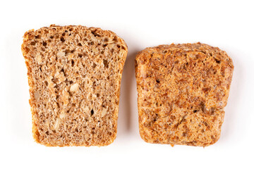 Two slices of whole-grain rye flour bread on a white isolated background. Top view, close-up, crust. Bread without yeast, with sourdough. Proper nutrition. Template, design.