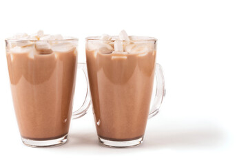 Two transparent glass mugs with hot cocoa drink and marshmallow on a white insulated background. Side view. Space for text.