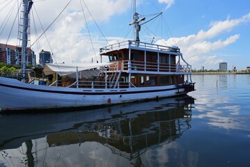 Indonesian traditional Phinisi ship. Pinisi or phinisi is a traditional two-masted Indonesian...