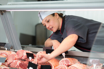 female butchers in a supermarket at work