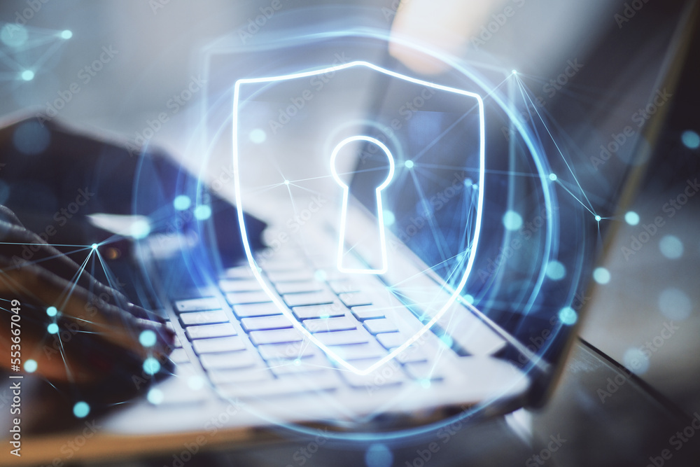 Poster close up of backlit female hands using laptop keyboard with glowing secure padlock shield hologram o