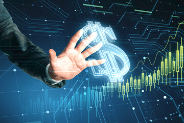 Close up of businessman hand using glowing dollar hologram on blurry background. Money and digital finance concept. Double exposure.