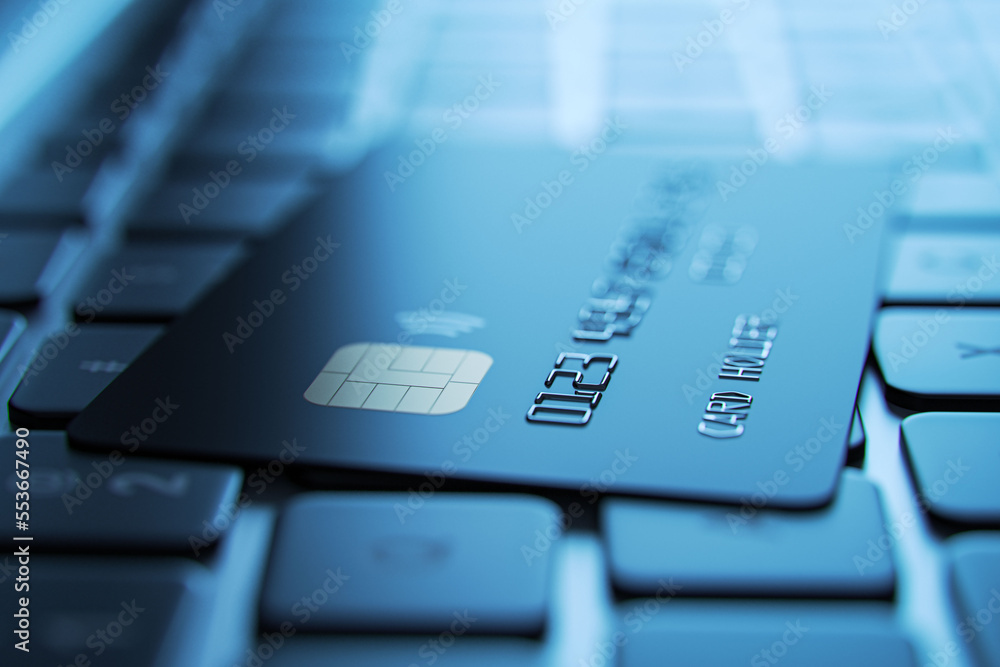 Poster online payment and online shopping concept with dark color credit card on modern laptop keyboard bac