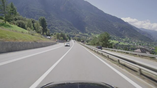 Driving on the Simplon Pass in Switzerland. The Simplonpass is a famous road in the european alps. Drivers point of view.