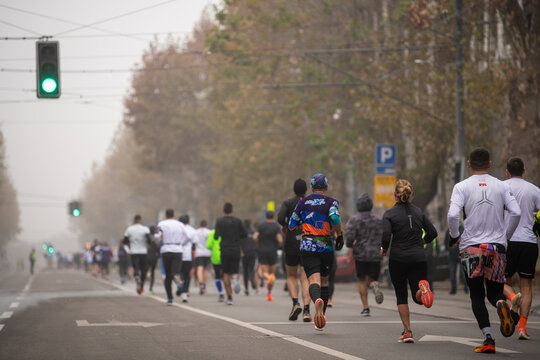 Belgrade, Serbia 27.11.2022 Runners compete in race on Traditional Belgrade Marathon and Half Marathon on cold November day during Fog and high Air Pollution.