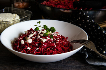 Homemade pasta with beets and goat cheese