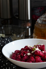 Homemade pasta with beets and goat cheese