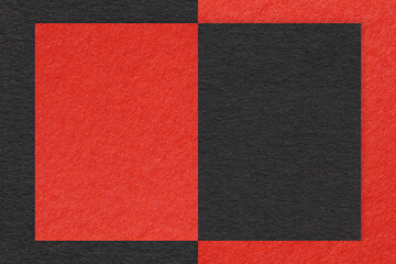 Texture of red and black paper background with geometric shape and pattern, macro. Structure of craft cardboard