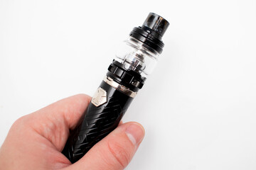 Electronic cigarette in mens hand