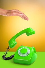 Colorful old retro phone and female hand