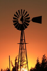 windmill at sunset in Kansas.