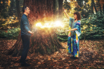 Man and woman heal each other with healing energy. Pranic healing.