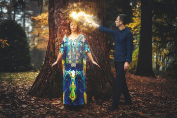 Man and woman heal each other with healing energy. Pranic healing.