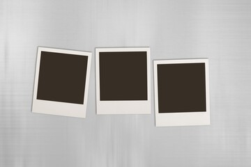 Blank retro photo frames on desk.