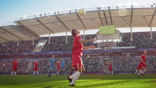 Soccer Football Championship on Professional Stadium: Red Team Player Receives Pass, Does Chest Trap, Forward Leads His Team to Victory. Cup Tournament. Cinematic Slow Motion