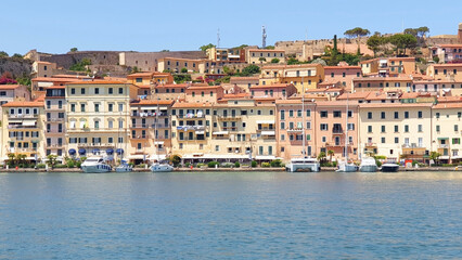 Fototapeta na wymiar View from the sea to the city of Portoferraio, located on the island of Elba in Italy. Panorama.