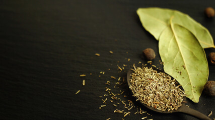 Thyme dry and bay leaf on a dark background