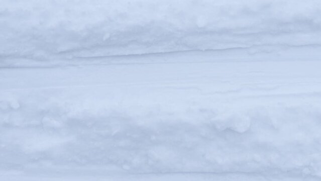 Ski run traces background Seamless Loop. Snow skiing track surface. Ski trail texture.