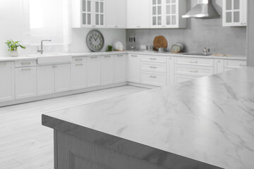 Stylish white marble countertop in kitchen. Interior design