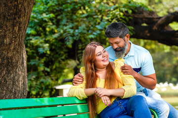 Fototapeta premium Young indian couple enjoying and spending quality time at park.