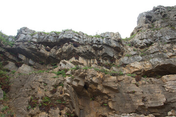 Isolated PNG cutout of a cliff on a transparent background, ideal for photobashing, matte-painting, concept art