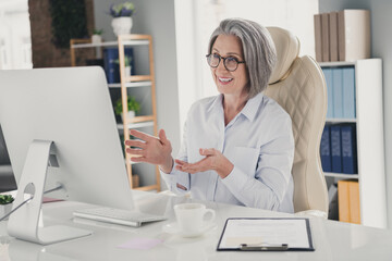 Photo of smiling busy lady coach wear white shirt eyeglasses presenting new working seminar modern...