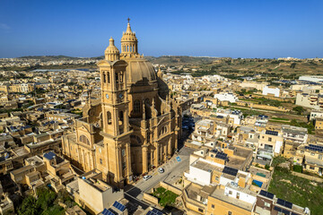Fototapeta na wymiar Rotunda St. John Baptist Church in the town of Xewkija, Gozo, Malta. Aerial drone view