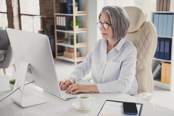 Photo of busy attractive lady clerk dressed white shirt eyewear chatting modern device indoors...
