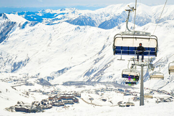 25th january, 2022 - Gudauri, Georgia: skier instructor sit on the char lift and with new Gudauri...