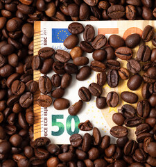 Euro bill in black coffee beans.