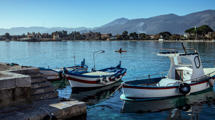 Fototapeta na wymiar Small port with fishing boats in the center of Mondello, Palermo, Sicily