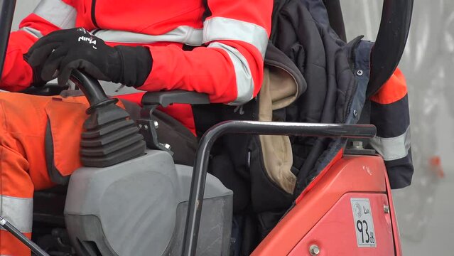 Operator's hands on the joysticks of tractor excavator, High quality 4k footage