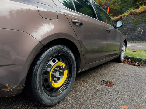 Paris, France - Oct 2, 2022: Side View Of Skoda Octavia Brown Car With Spare Tire Wheel Nexen N'Blue HD Plus