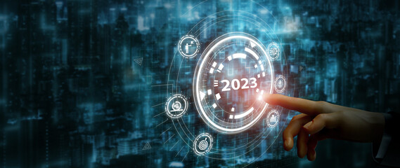 2023 automation technology and business transformation, adaptation, changing concept. Transform business model and automation strategy for thriving business. Finger about to press a button with 2023.