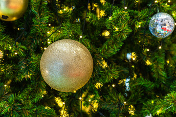 Merry x-mas,Close up of Colorful balls ,gifts box and Christmas greeting picture parcel decoration on Green Christmas tree background Decoration During Christmas and New Year.