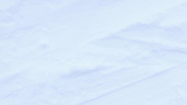 Snow skiing track surface seamless loop. Ski trail texture. Ski run traces background.