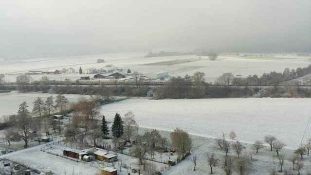 Aerial Drone Shot of Inter City Express ICE Train in Germany in the Snow on a Winters Day