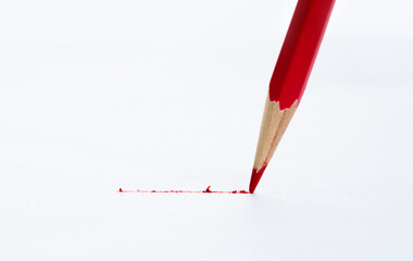 Color pencil drawing a line on white background