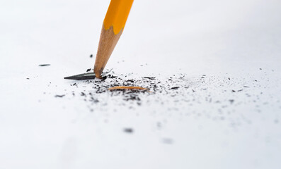Broken pencil on white background