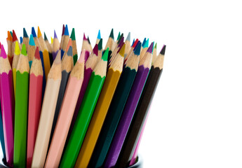 Colorful pencils in metal basket on white background