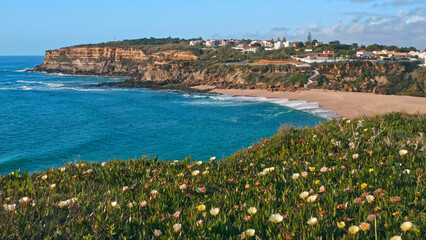 Beautiful coastline seascape in Europe.  Beautiful rocky seascape with rolling waves to the shore. Aerial view: beautiful nature landscape. Drone view of scenic nature  in Portugal.