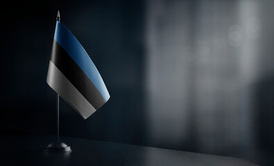Small national flag of the Estonia on a black background