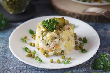 Olivier salad, traditional Russian dish, served on the plate