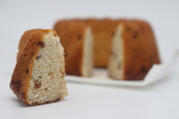 classic vanilla homemade chiffon cake with small edible black raisin.
