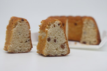 classic vanilla homemade chiffon cake with small edible black raisin.