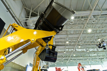 Close up of excavator in exhibition hall
