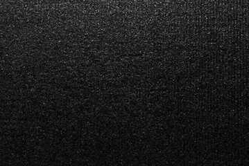 Black ribbed craft paper texture with glitter effect
