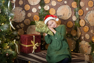 Cute girl in a cozy room with Christmas interior in Farmhouse style