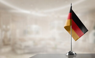 A small Germany flag on an abstract blurry background
